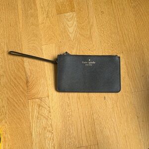 kate spade black leather wristlet with gold logo